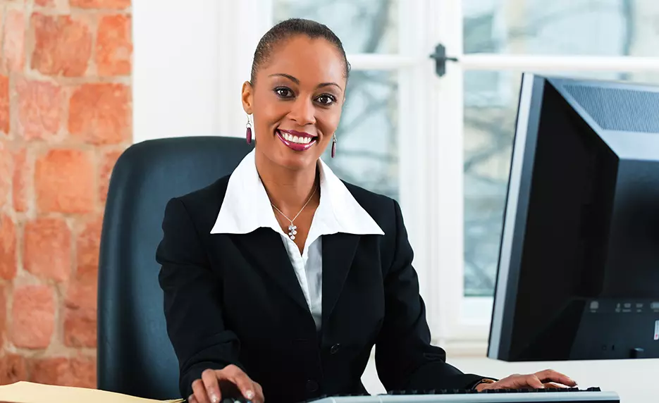 woman in a suit at a desk